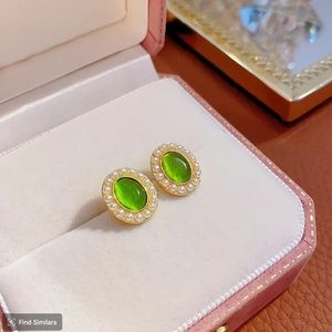 Oval Emerald Green Colored Stud Earrings